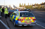 Police pulling over a car