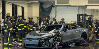 "Firefighters Extinguish Burning Audi EV Outside Service Center"