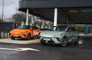 MG 4 XPower drives past an MG 4 Extended Range in a car park