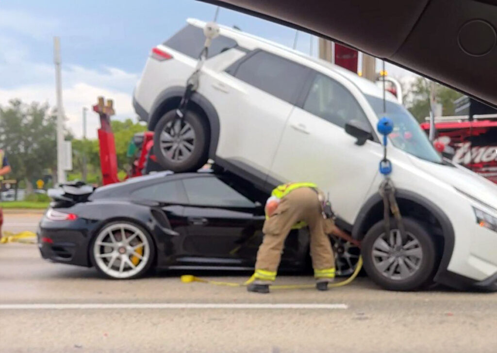  This Porsche 911 Looks Great Considering There's A Nissan Pathfinder On Top Of It