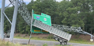 Trailer-Tractor Collides with Highway Exit Sign, Detaching Raised Bed | Giga Gears